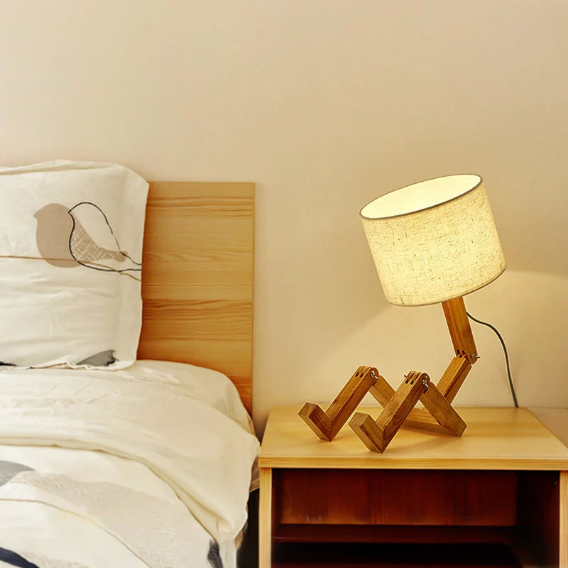 Robot shaped LED table lamp with flexible wooden base and linen shade