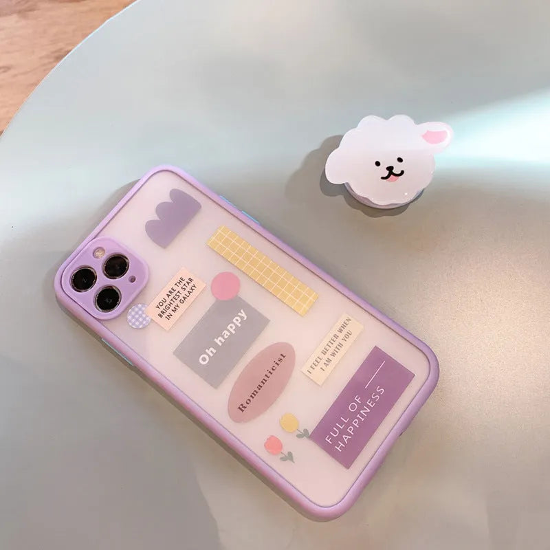 Frosted painted TPU mobile phone case with a built-in folding bracket, shown in a cartoon design for Apple iPhone.