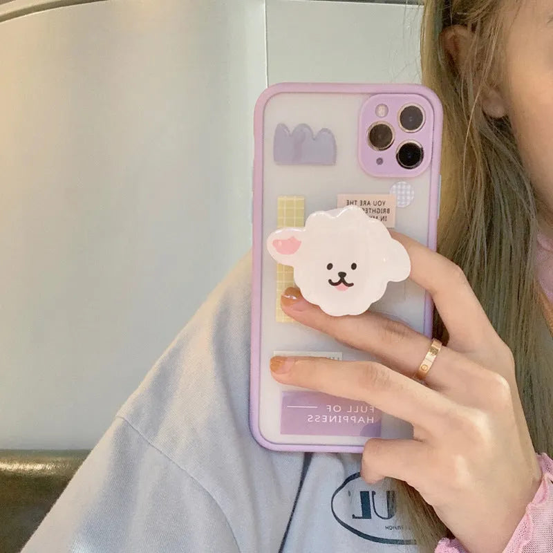 Frosted painted TPU mobile phone case with a built-in folding bracket, shown in a cartoon design for Apple iPhone.