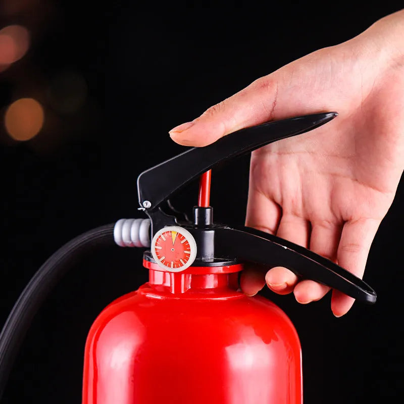 2L clear acrylic fire extinguisher-shaped beverage dispenser with hand-press pump on a party table