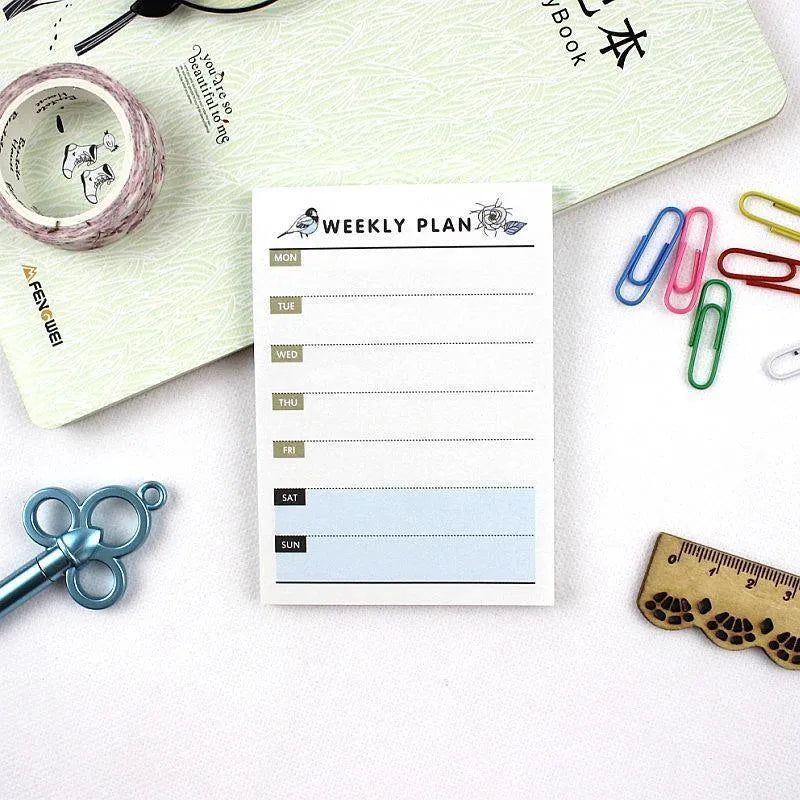 Compact work plan diary notebook showing four design options for weekly and monthly planning