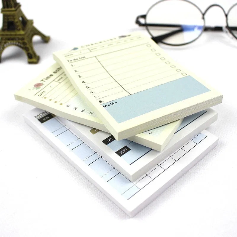 Compact work plan diary notebook showing four design options for weekly and monthly planning