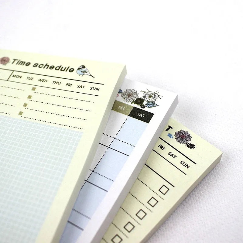 Compact work plan diary notebook showing four design options for weekly and monthly planning