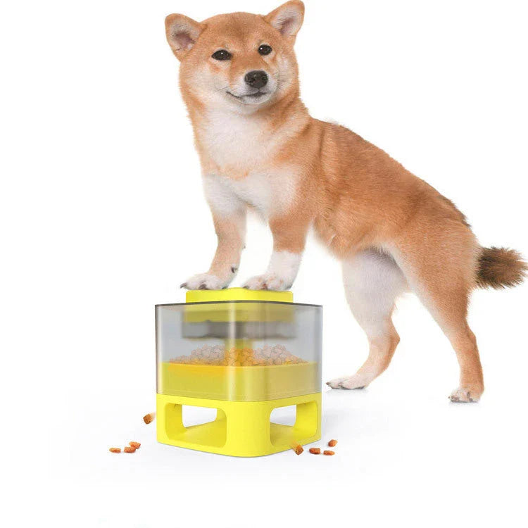 Interactive dog food feeder with anti-slip base in white and yellow