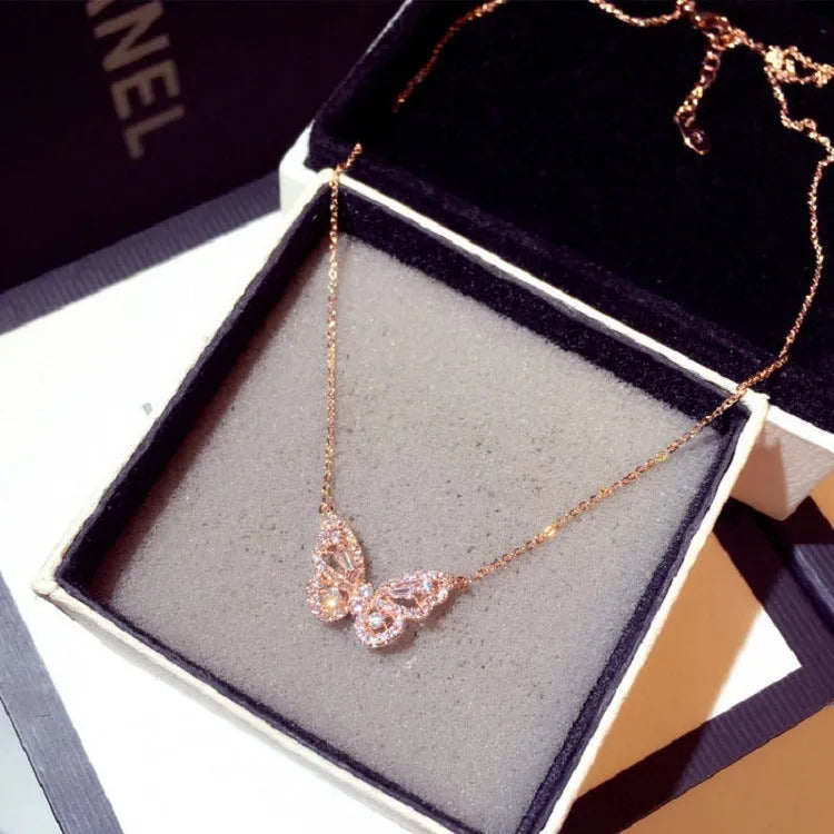 Butterfly pendant necklace with micro-inlaid zircon on water wave chain, gold finish, clavicle length