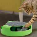 Green plastic mouse cat toy with scratch board surface on a flat surface