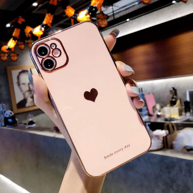 Solid colour TPU back cover case for iPhone in pink, showing slim profile and camera cutout