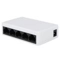 White 5-port 100 Mbps Ethernet switch with LED indicators on a desk