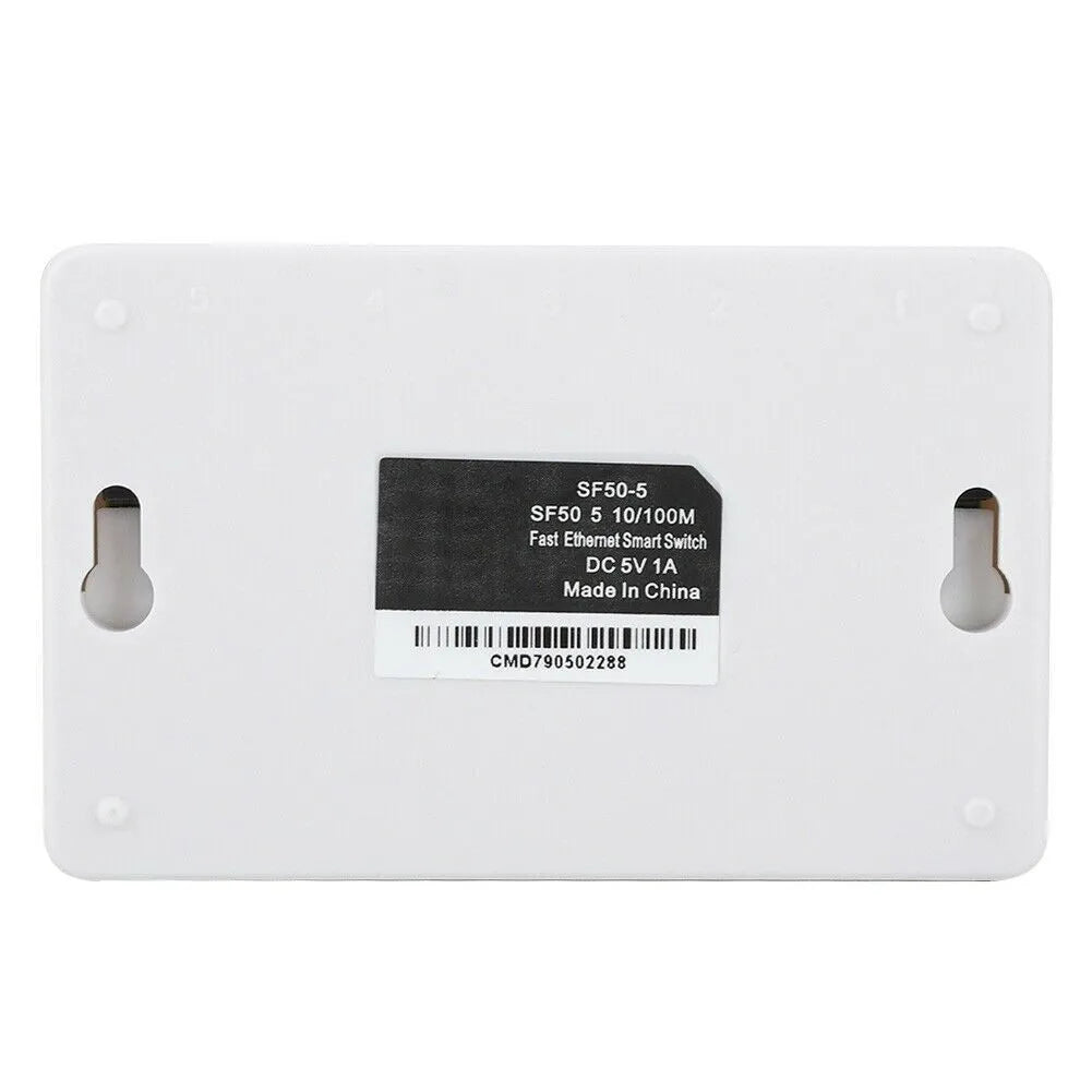 White 5-port 100 Mbps Ethernet switch with LED indicators on a desk