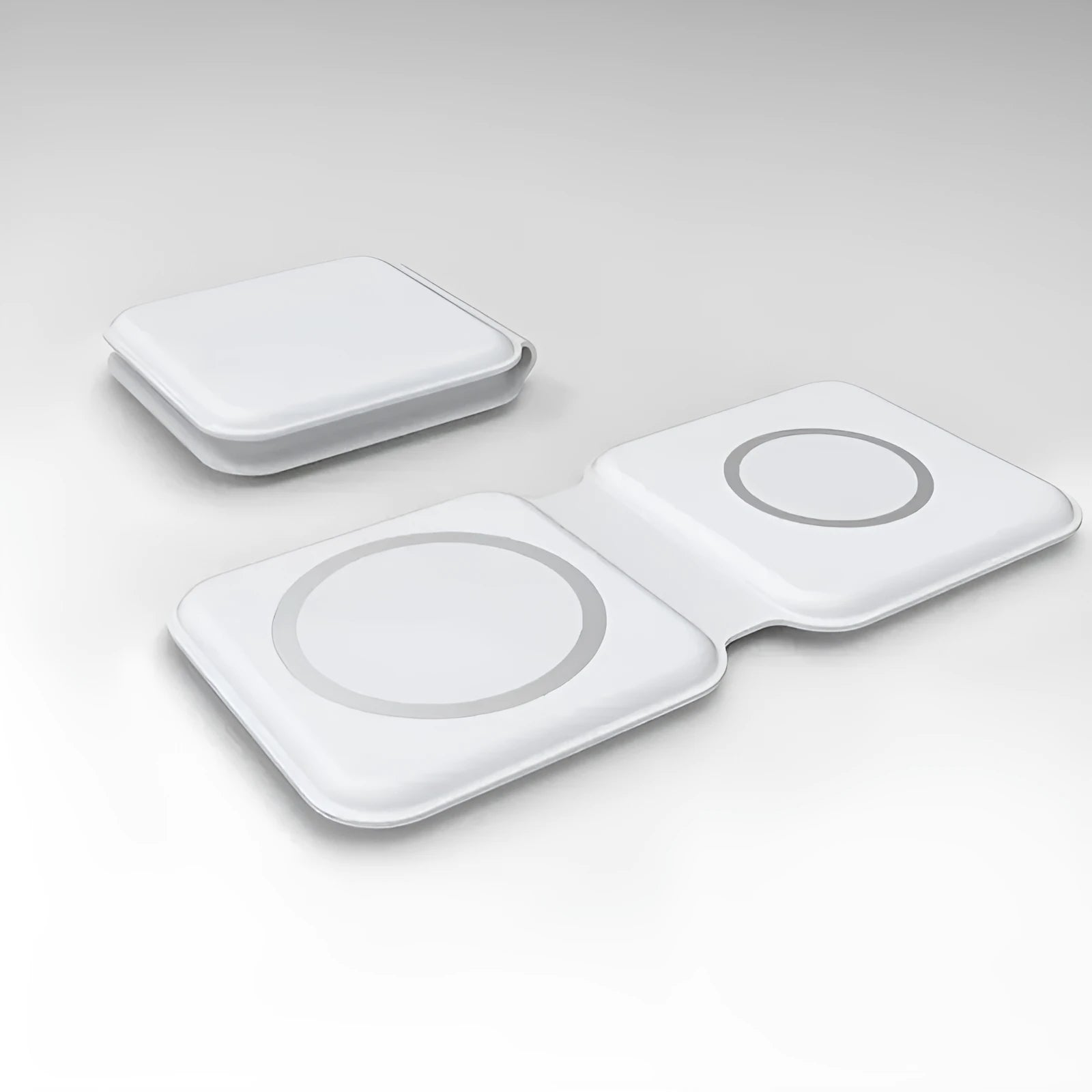 White foldable magnetic wireless charging dock showing two phones charging simultaneously at an angle.