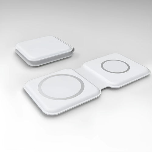 White foldable magnetic wireless charging dock showing two phones charging simultaneously at an angle.