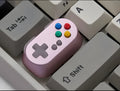 Wireless mechanical keyboard switch with metal transparent keycap in blue colour and game console handle design