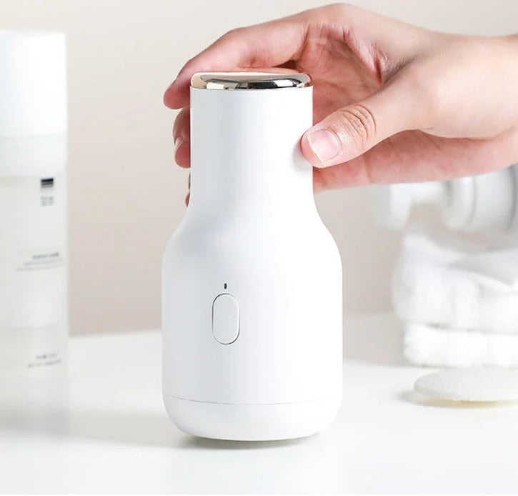 Electric Foot File Grinder in pink, blue, and white for dead skin removal