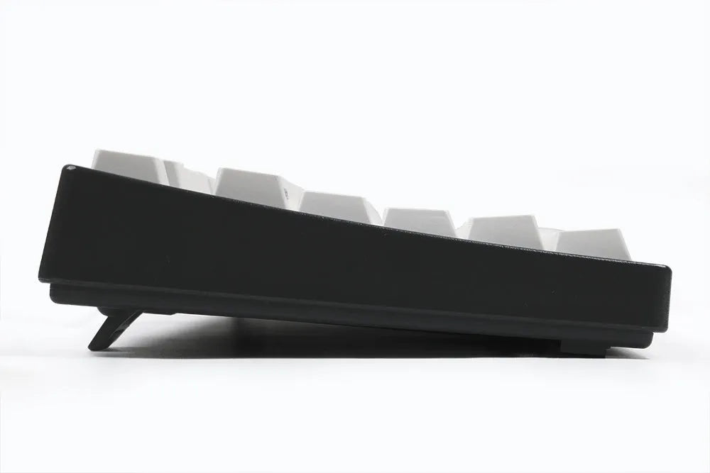 Black and white Japanese minimalist sublimation keycap set with 104 PBT keycaps in original factory height on a flat surface.
