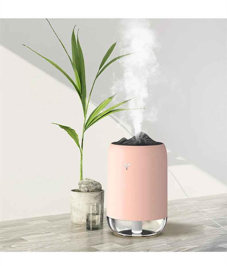 Magic Flame Humidifier in white, light blue, and pink, compact ultrasonic humidifier for small spaces