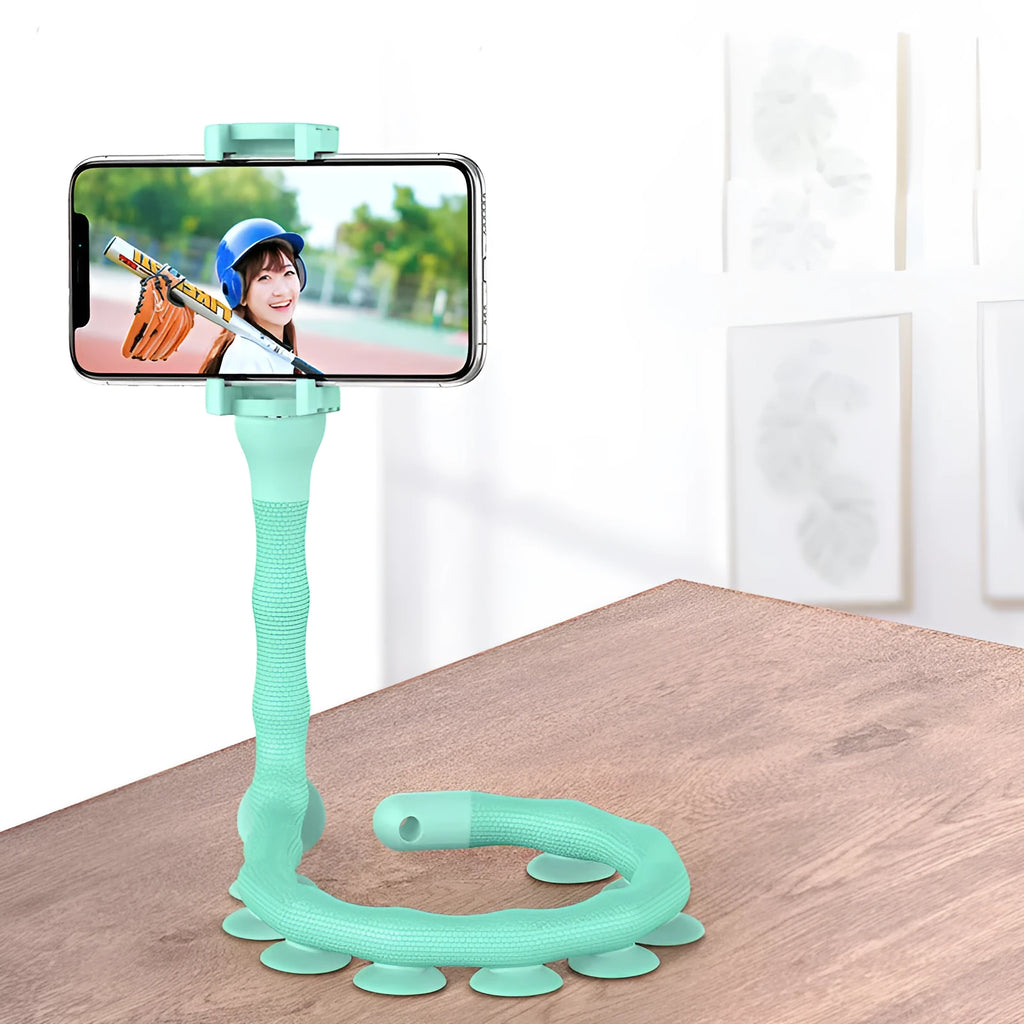 Black flexible arm phone holder with suction cup mounted on a desk, showing 360° rotation.