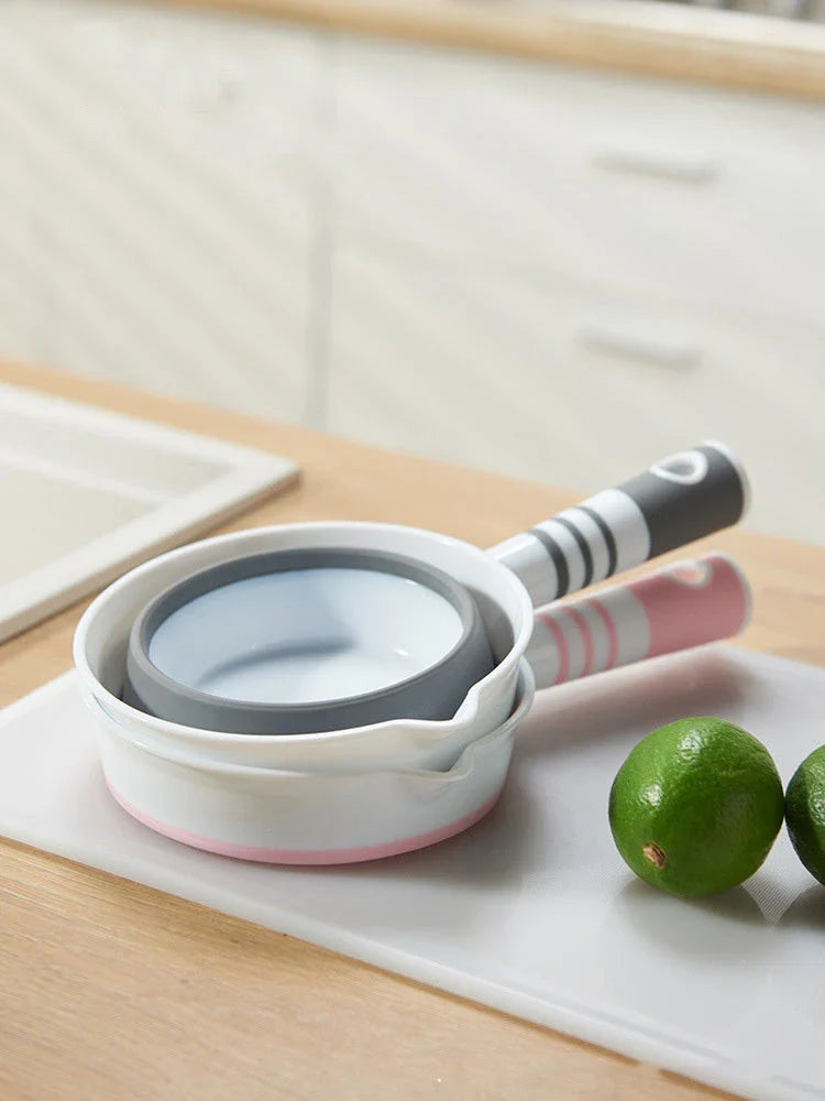 Folding portable collapsible bucket in grey and pink, perfect for outdoor and kitchen use