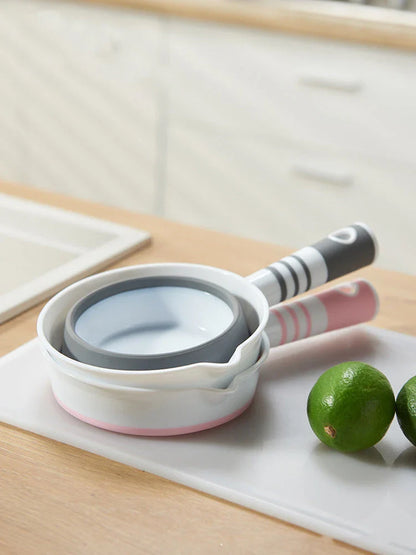 Folding portable collapsible bucket in grey and pink, perfect for outdoor and kitchen use