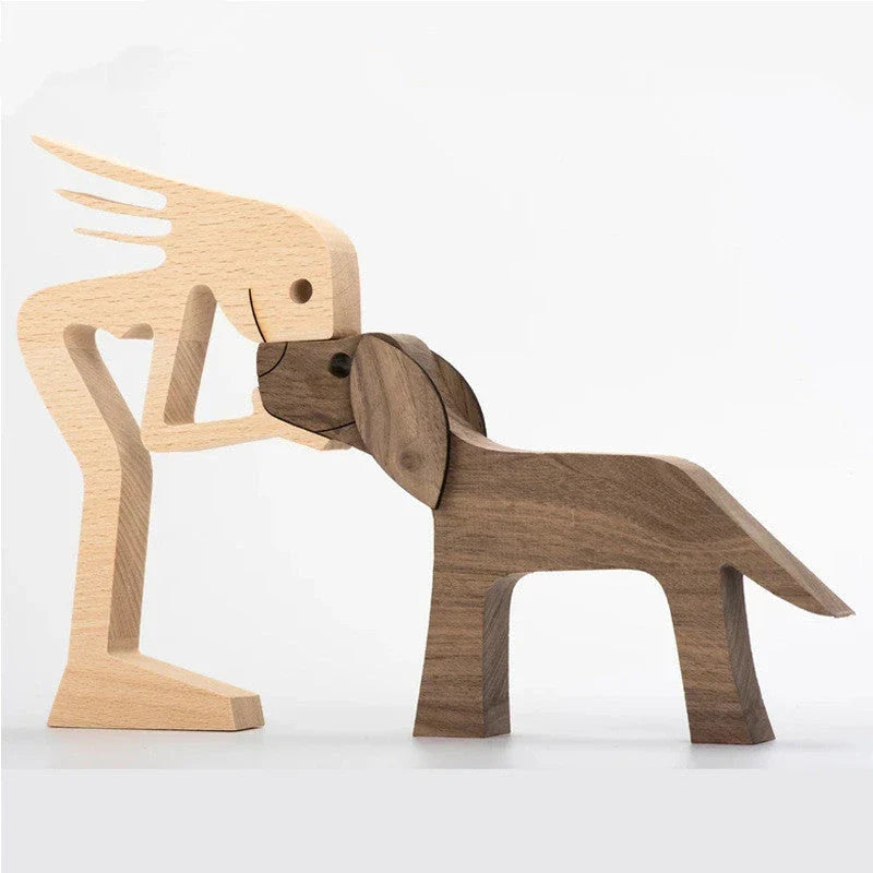 Handcrafted wooden dog sculpture featuring a man and his loyal canine companion