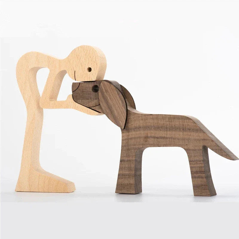 Handcrafted wooden dog sculpture featuring a man and his loyal canine companion