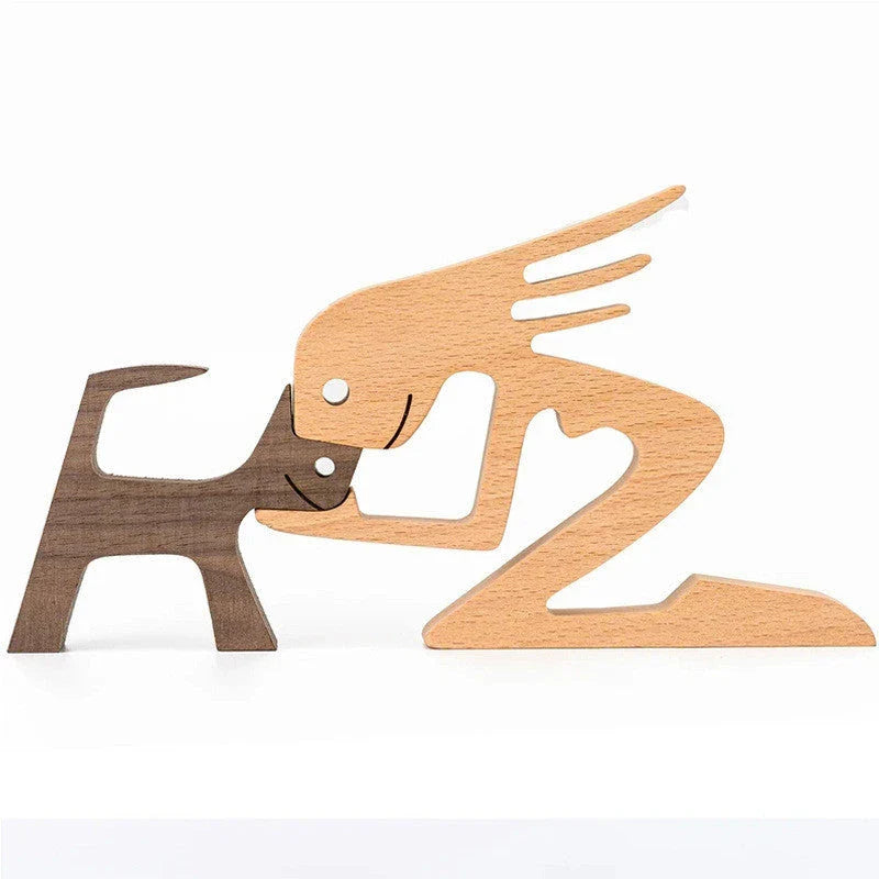 Handcrafted wooden dog sculpture featuring a man and his loyal canine companion