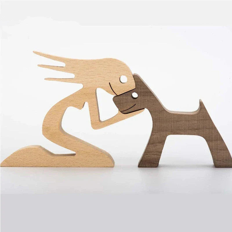 Handcrafted wooden dog sculpture featuring a man and his loyal canine companion