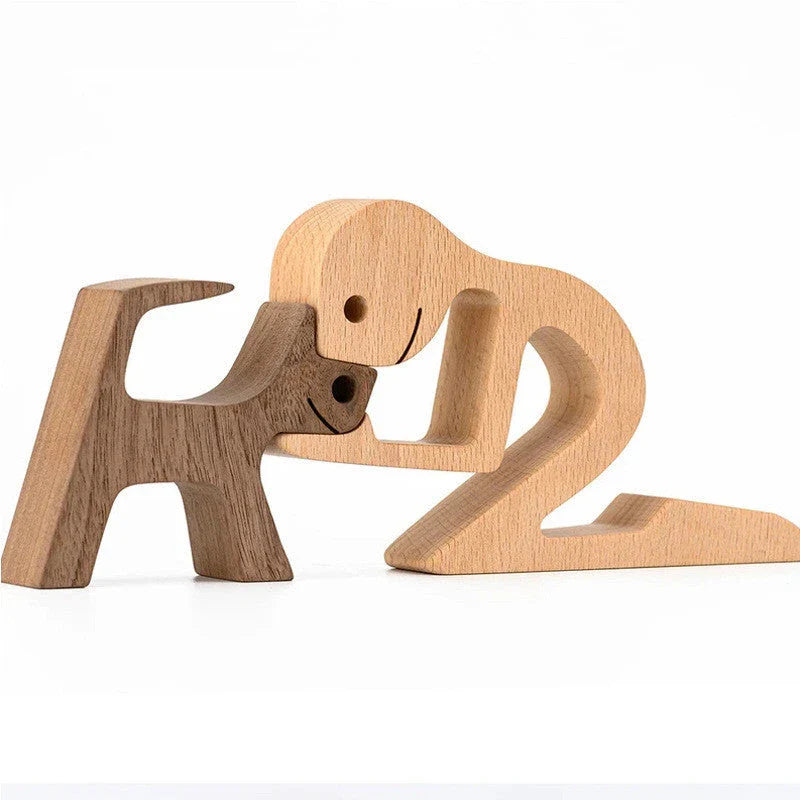 Handcrafted wooden dog sculpture featuring a man and his loyal canine companion