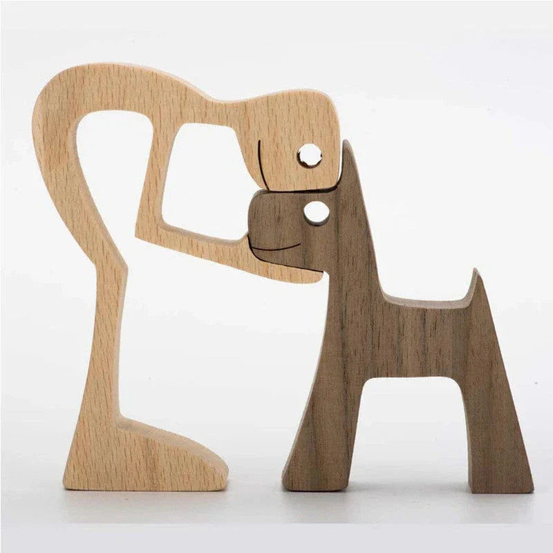 Handcrafted wooden dog sculpture featuring a man and his loyal canine companion