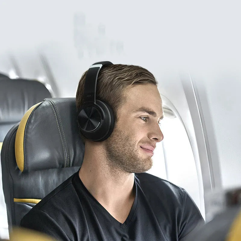 Black wireless Bluetooth headphones with active noise cancellation and an over-ear headband.