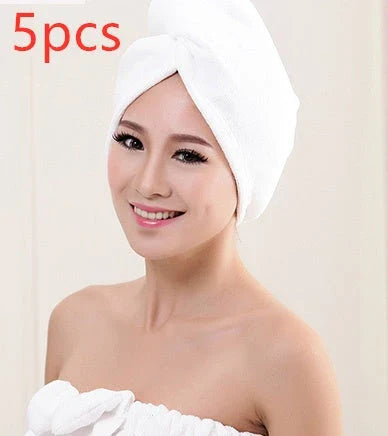 Absorbent microfiber hair turban in various vibrant colours, designed for fast and convenient drying