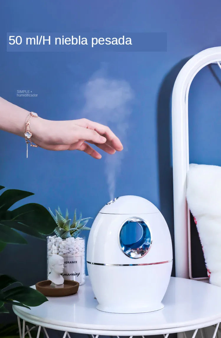 White round USB aromatherapy humidifier with 800ml tank and quiet 36dB operation.