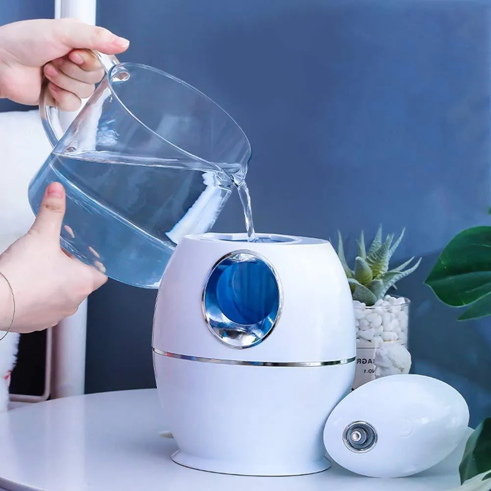 White round USB aromatherapy humidifier with 800ml tank and quiet 36dB operation.