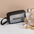 Korean transparent PU waterproof cosmetic bag in cherry pink, medium size, on a white background, showing its cube shape and zip closure.