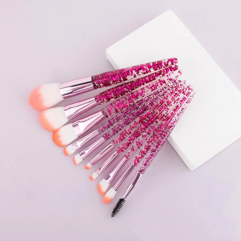 10 makeup brushes with pink powder-filled handles and nylon bristles arranged in a fan shape