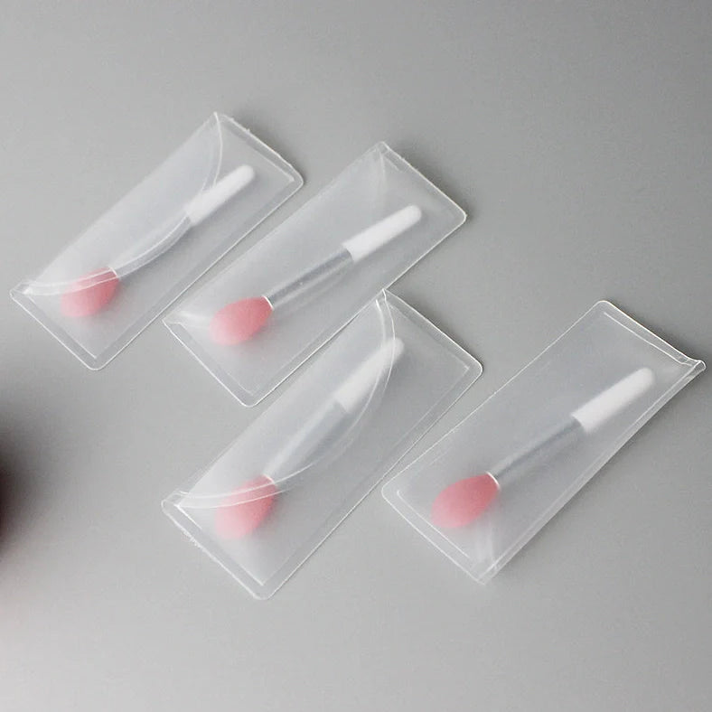 Crystal rod lip brush with synthetic fibre bristles in six colour options on white background