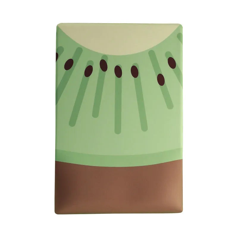 Green kiwi fruit shaped mouse pad with integrated soft wrist support cushion on a desk.