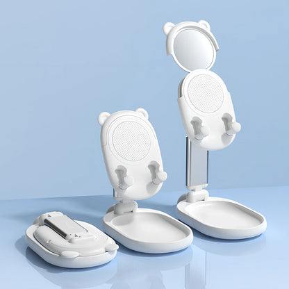 Adjustable desk phone stand with mirror holding iPad, showing 360-degree rotation capability