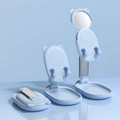 Adjustable desk phone stand with mirror holding iPad, showing 360-degree rotation capability