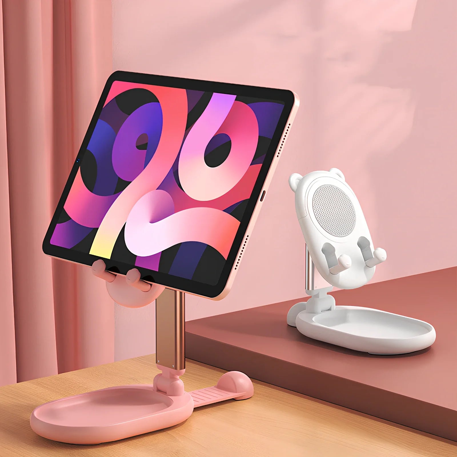 Adjustable desk phone stand with mirror holding iPad, showing 360-degree rotation capability