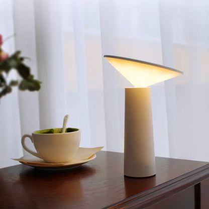 A modern LED desk lamp with three-colour lighting modes, touch controls, and a 360-degree rotating head for versatile illumination