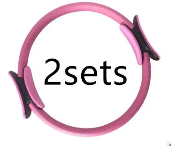 Pink Pilates ring with ergonomic curve on floor for core strength and posture exercises