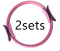 Pink Pilates ring with ergonomic curve on floor for core strength and posture exercises