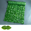 Green artificial plastic fence net with colour-printed radish leaves, shown in watermelon and apple leaf patterns.