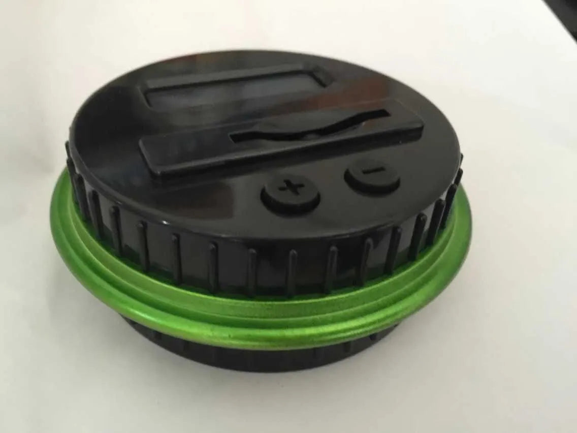 Transparent digital coin counting money box with LCD screen on lid, showing coin slot and clear jar body