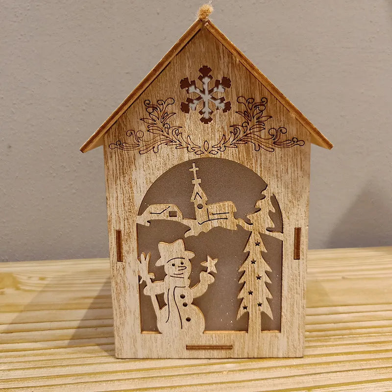 Three wooden Christmas house decorations showing log bell, Santa house, and snowman designs in natural wood colour