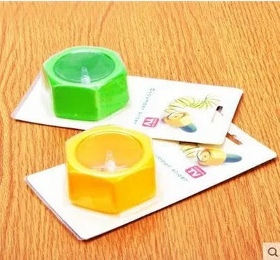 Yellow or green ABS plastic spiral vegetable cutter for creating julienne strips from cucumbers