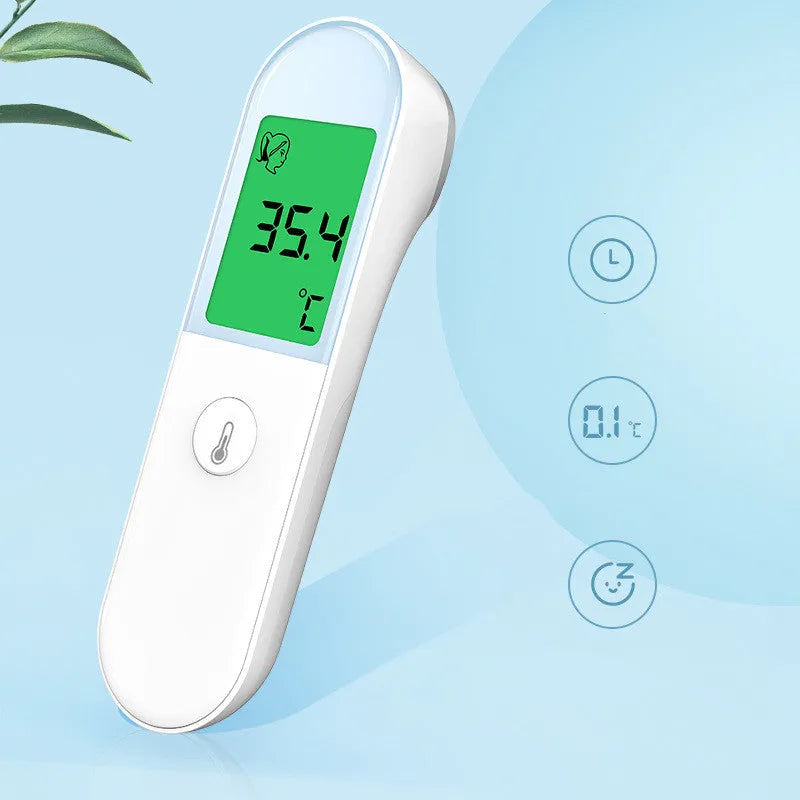White intelligent non-contact electronic forehead thermometer temperature gun on surface
