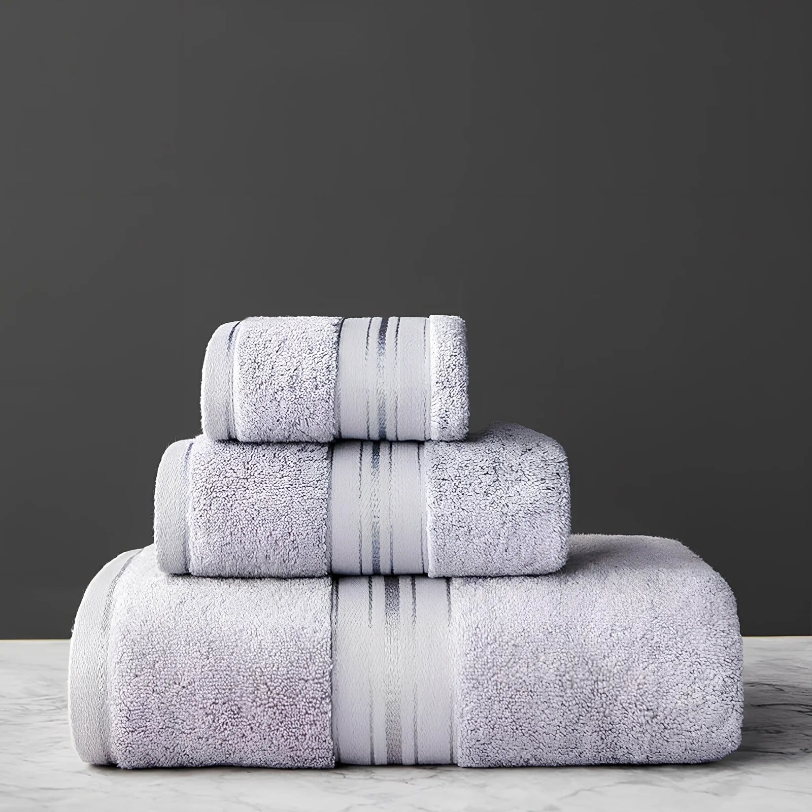 Three-piece cotton bath towel set in blue, featuring 70x150cm bath towel, 34x75cm hand towel, and 34x35cm square scarf for absorbent drying