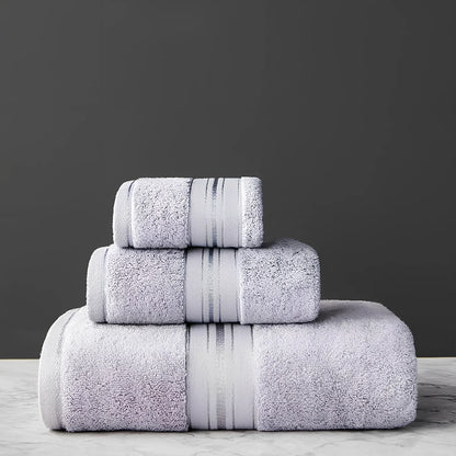 Three-piece cotton bath towel set in blue, featuring 70x150cm bath towel, 34x75cm hand towel, and 34x35cm square scarf for absorbent drying