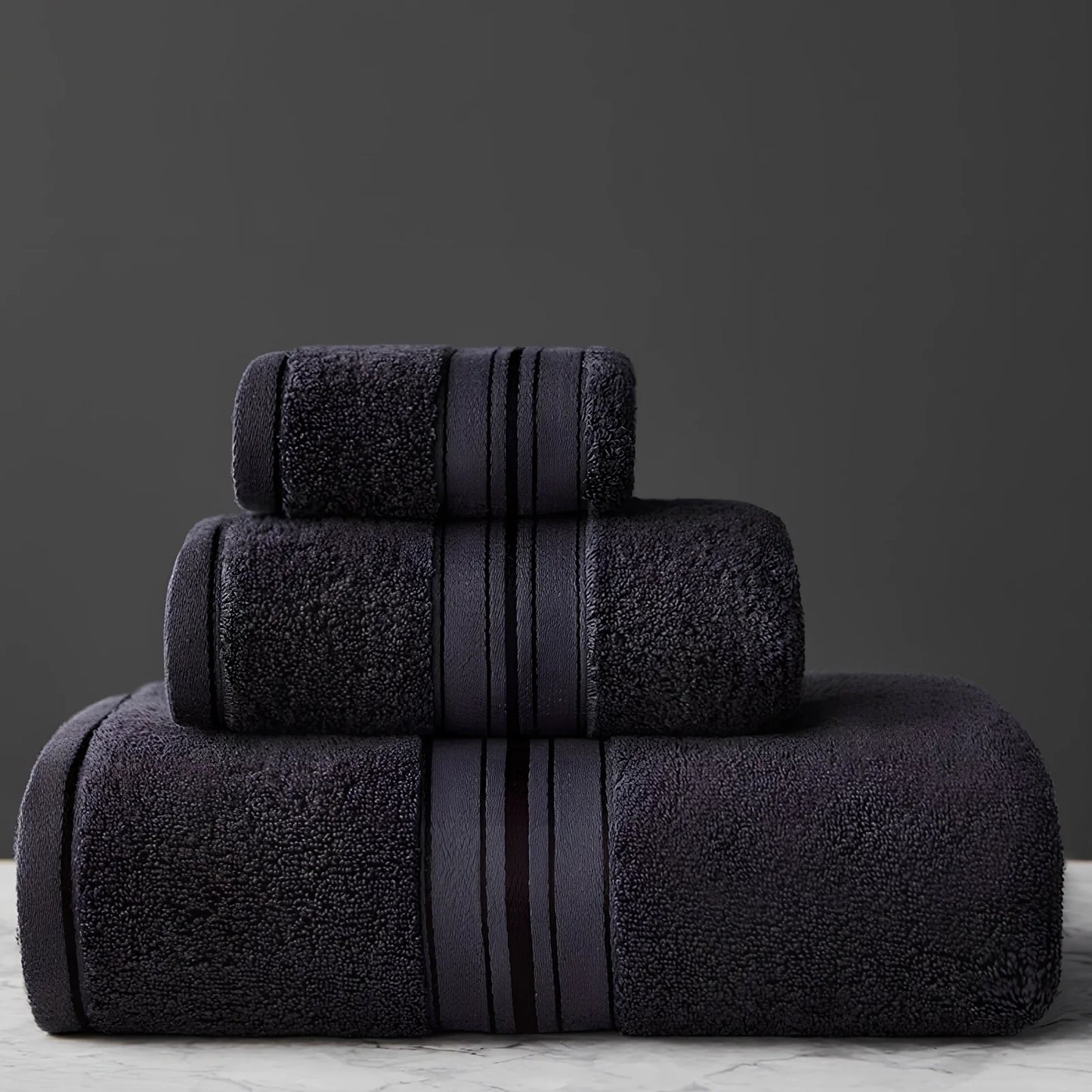 Three-piece cotton bath towel set in blue, featuring 70x150cm bath towel, 34x75cm hand towel, and 34x35cm square scarf for absorbent drying